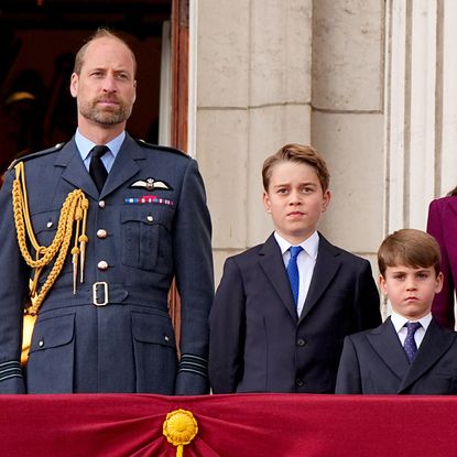 Prince William stands on the Buckingham Palace balcony with children Prince George, Princess Charlotte, and Prince Louis, and wife Kate Middleton