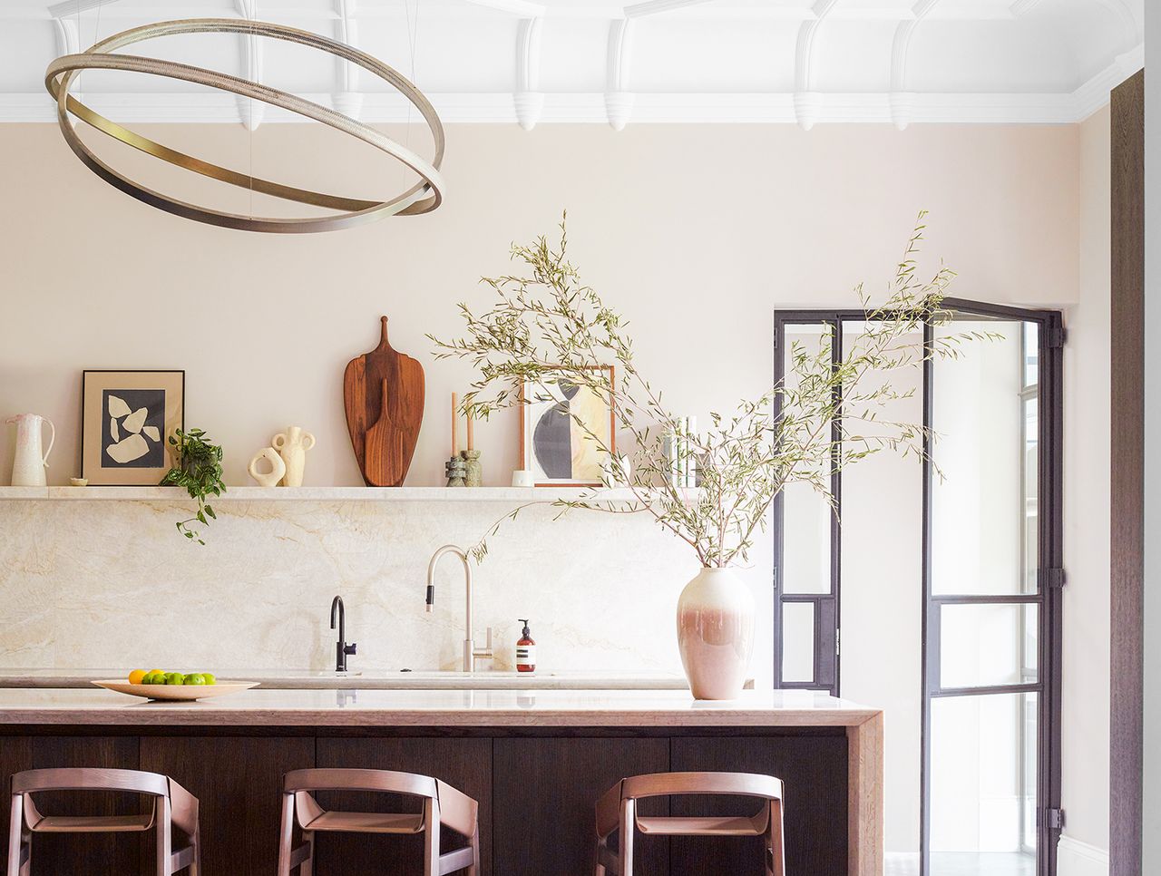 modern kitchen island with large round lighting 