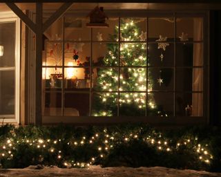 christmas tree and lighting through window