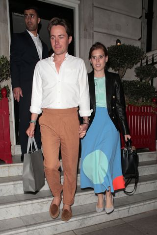 Princess Beatrice leaves a Wimbledon party in London while wearing a retro colorblock skirt