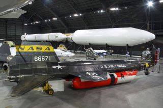 The North American X-15A-2 rocket plane (front) and the Lockheed Martin Titan IVB rocket (rear) on display in the new space gallery at the National Museum of the U.S. Air Force in Dayton, Ohio. 