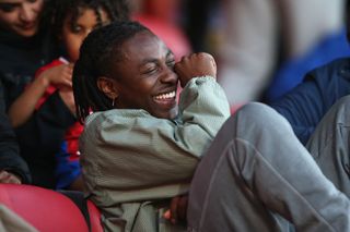 Eberechi Eze of Crystal Palace watches on from the stands during the Premier League International Cup Final between Crystal Palace FC U21 and Jong PSV U21 at Selhurst Park on May 15, 2024 in London, England