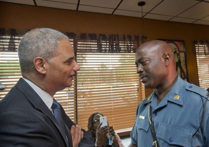 Attorney General Eric Holder visits students in Ferguson, vows 'change is coming'