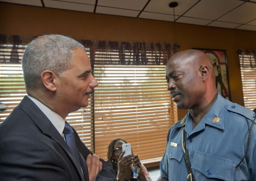 Attorney General Eric Holder visits students in Ferguson, vows &amp;#039;change is coming&amp;#039;