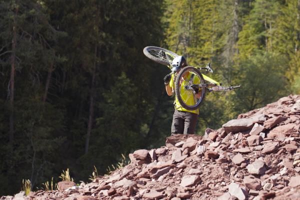 A rider hikes his bike