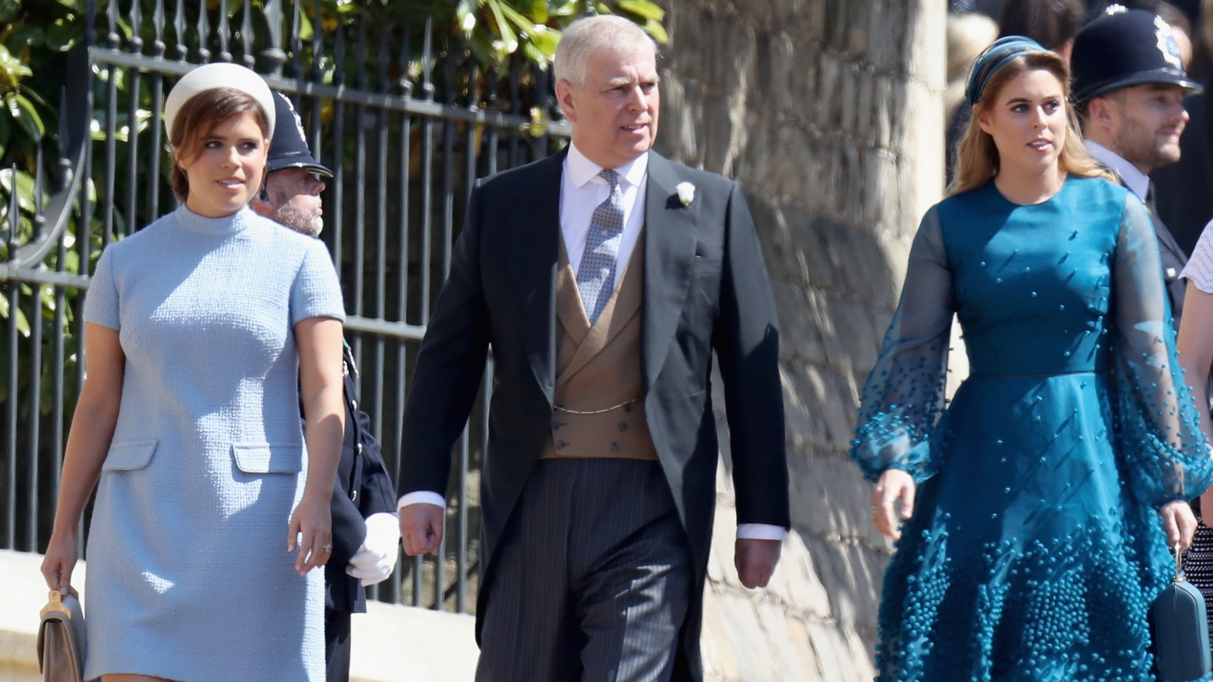 Princess Eugenie, Andrew and Princess Beatrice attend the wedding of Prince Harry to Meghan Markle