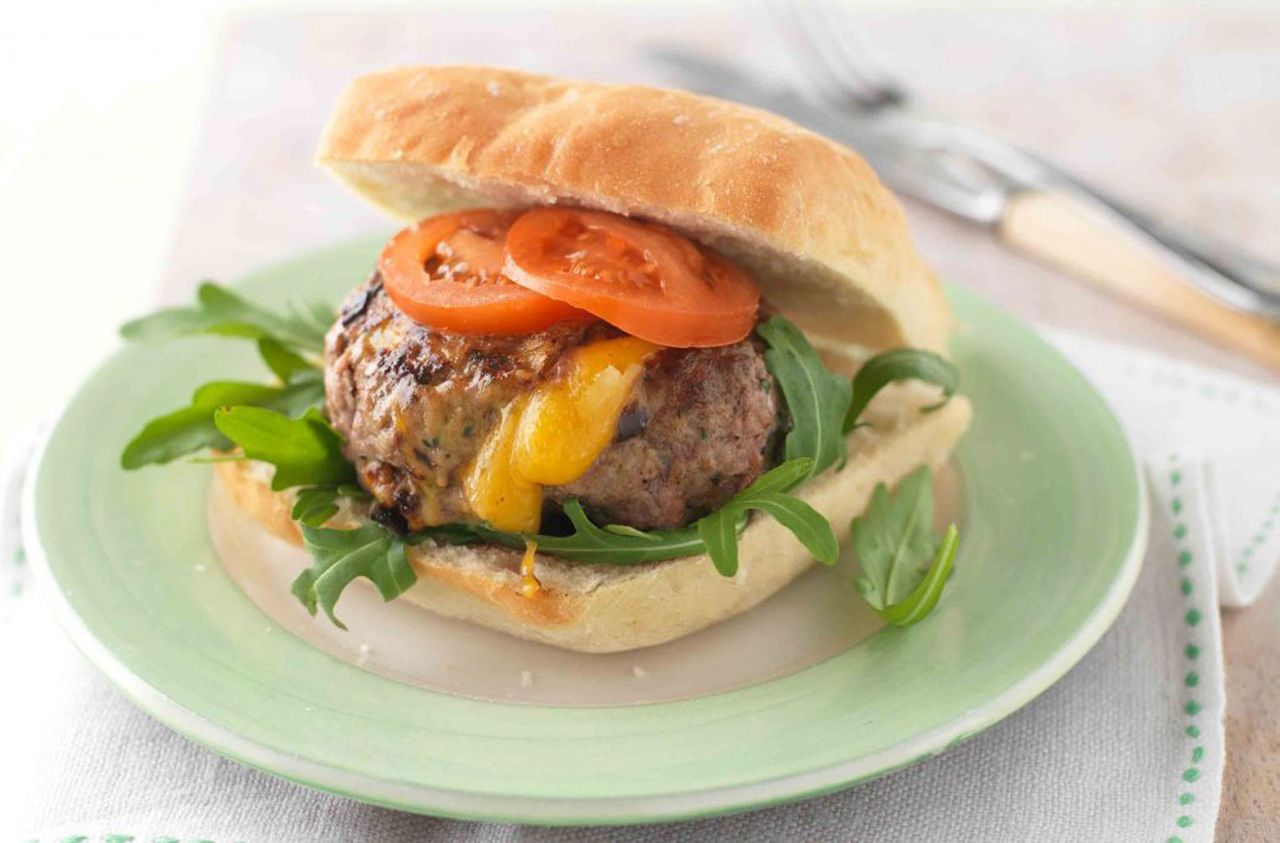 Melting cheese burgers and potato wedges