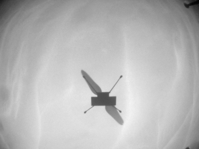NASA's Ingenuity Mars Helicopter acquired a silhouette image of itself with a navigation camera on December 15, 2021, during the robot's 18th Red Planet flight.