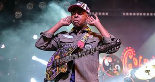 Vernon Reid cups his hands to his ears to the crowd has he performs live at the at the Fremont Street Experience on April 18, 2025.