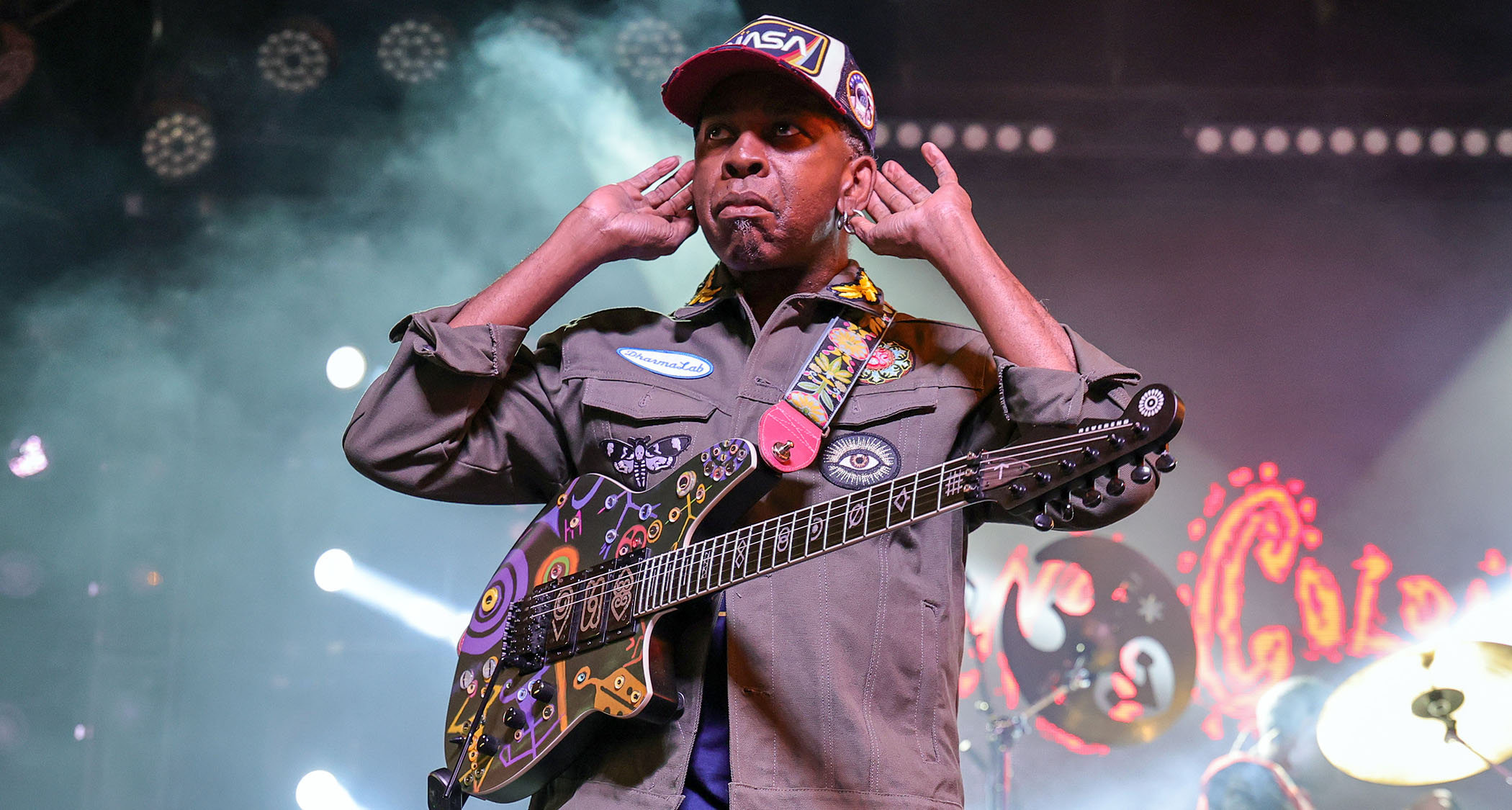 Vernon Reid cups his hands to his ears to the crowd has he performs live at the at the Fremont Street Experience on April 18, 2025.