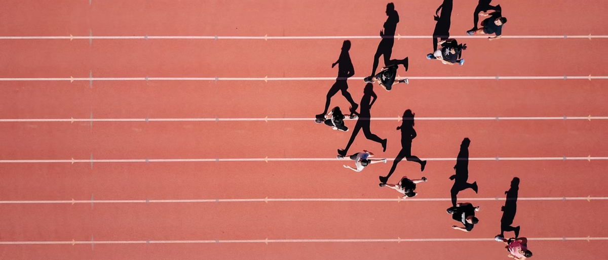 Top-down shot of track runners in training