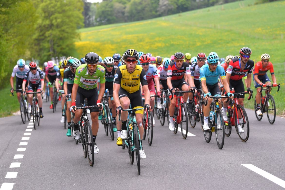 The peloton spreads across the road
