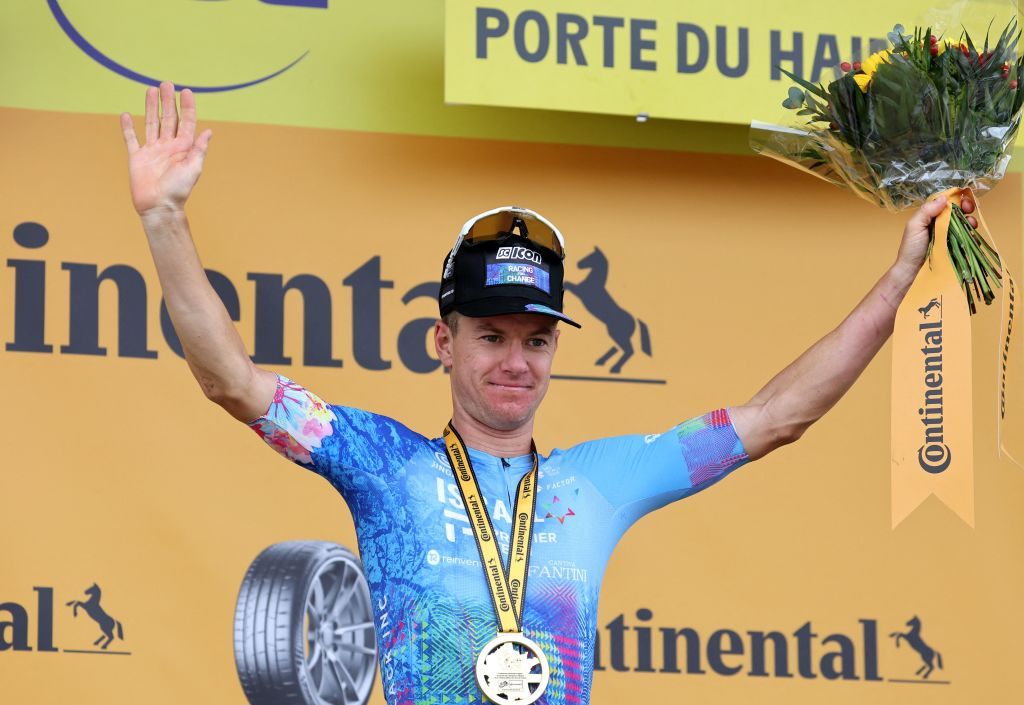 IsraelPremier Tech teams Australian rider Simon Clarke celebrates on the podium after winning the 5th stage of the 109th edition of the Tour de France cycling race 1537 km between Lille and Arenberg Porte du Hainaut in northern France on July 6 2022 Photo by Thomas SAMSON AFP Photo by THOMAS SAMSONAFP via Getty Images