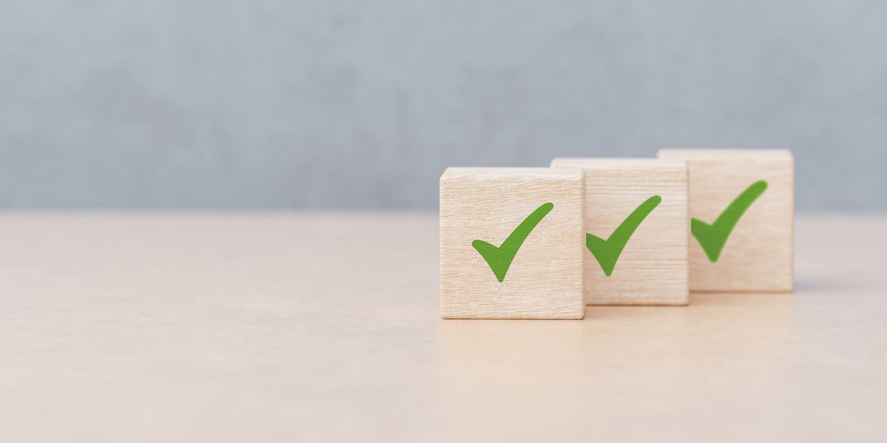 rendering of three wooden blocks with green checkmarks on them