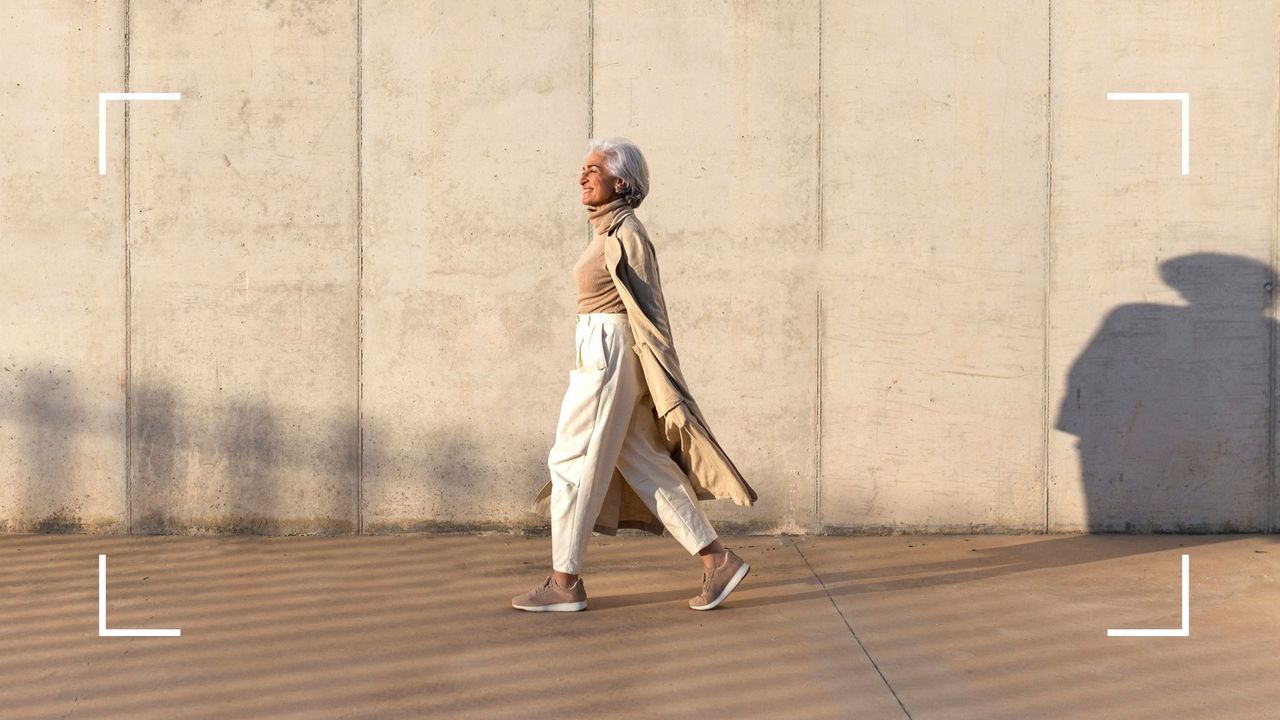 Woman walking along street