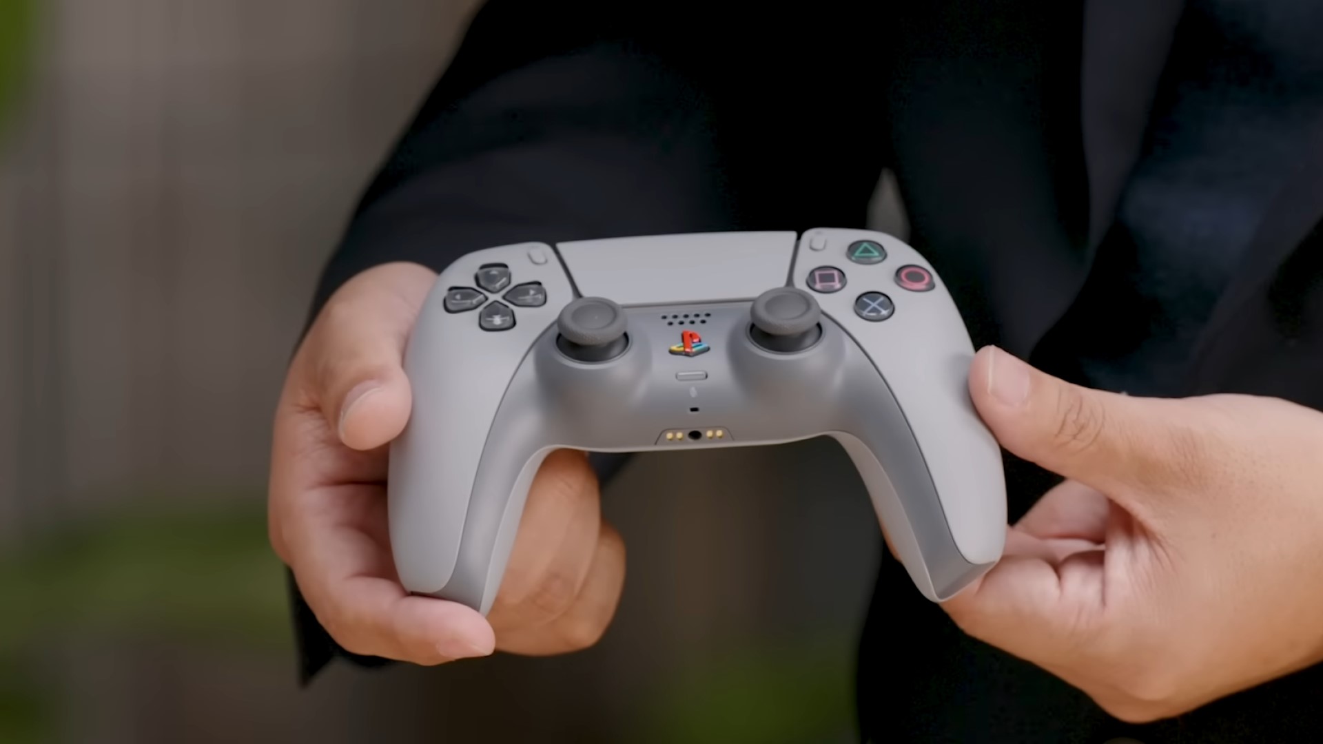 PlayStation 30th Anniversary DualSense controller in your hands