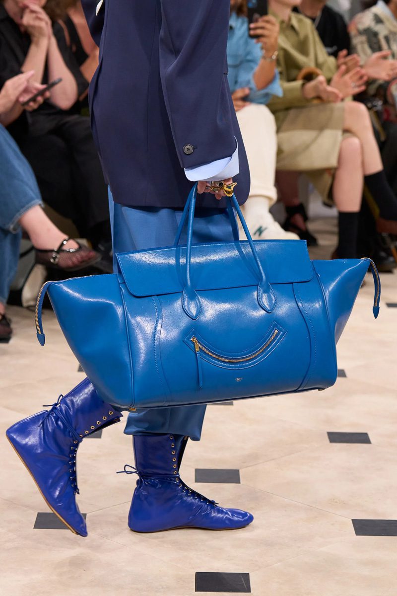 a model walking Celine's Spring 2026 collection carrying a blue Celine luggage phantom bag