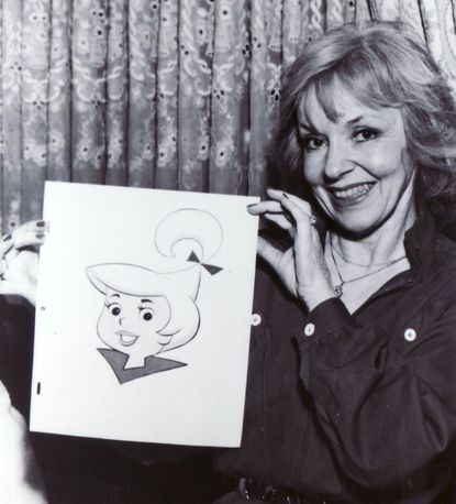 Janet Waldo holds a drawing of Judy Jetson.