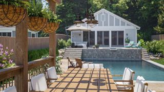 Backyard lighting ideas: image of outdoor chandelier otuside pool house