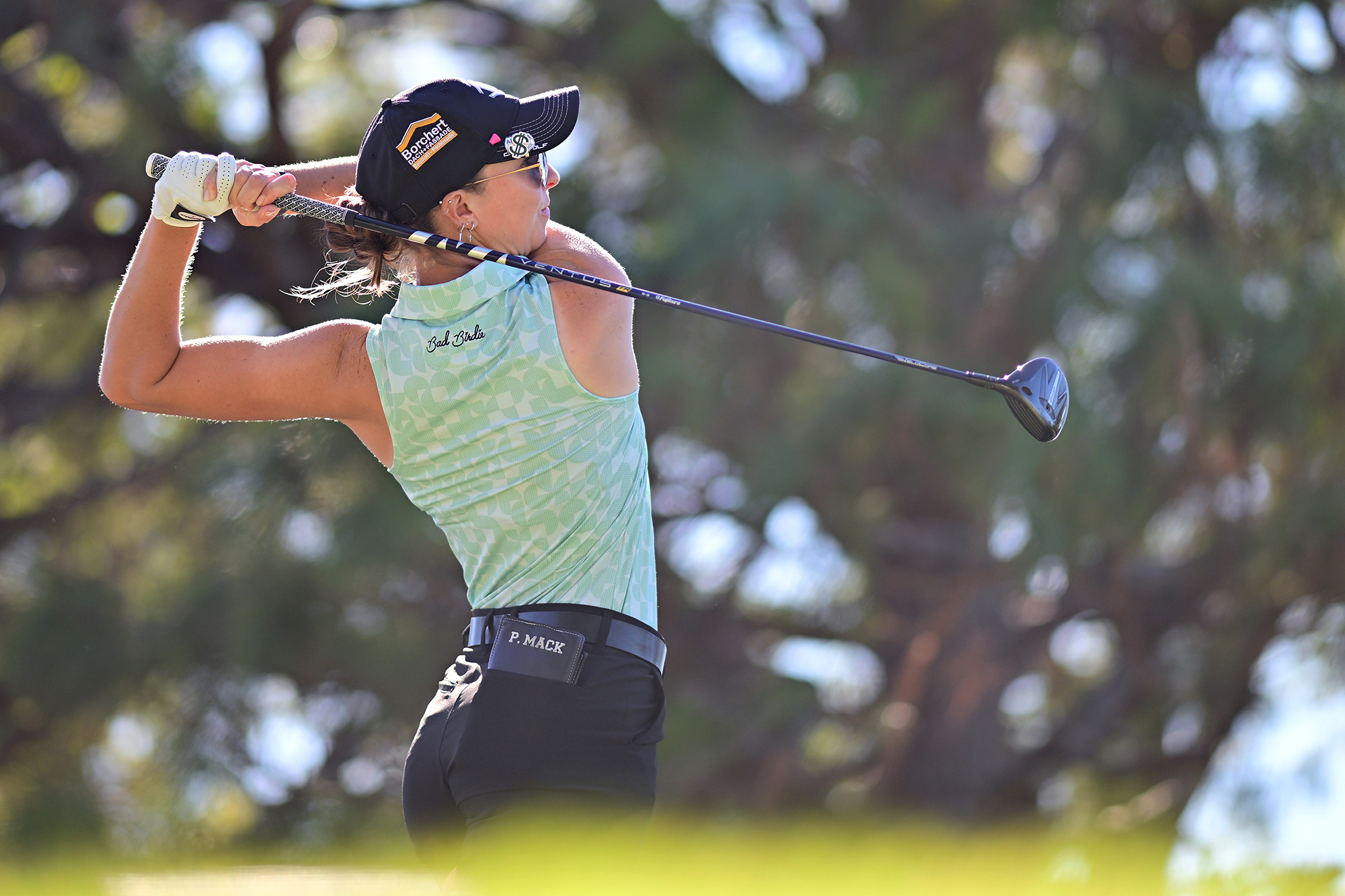 Polly Mack in the finish position after hitting a tee shot at an LPGA Tour event