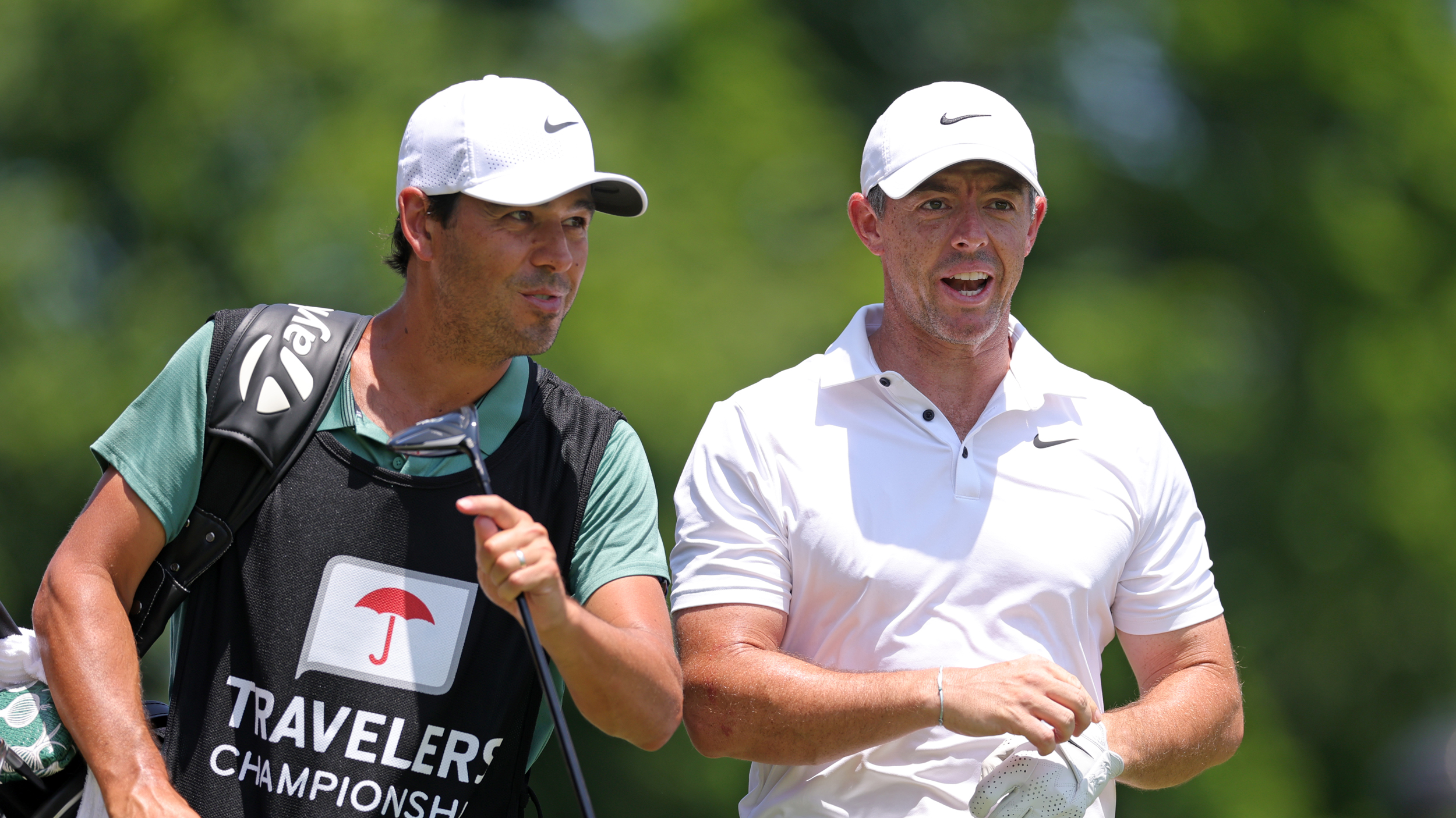 Harry Diamond (left) and Rory McIlroy talk during the 2025 Travelers Championship