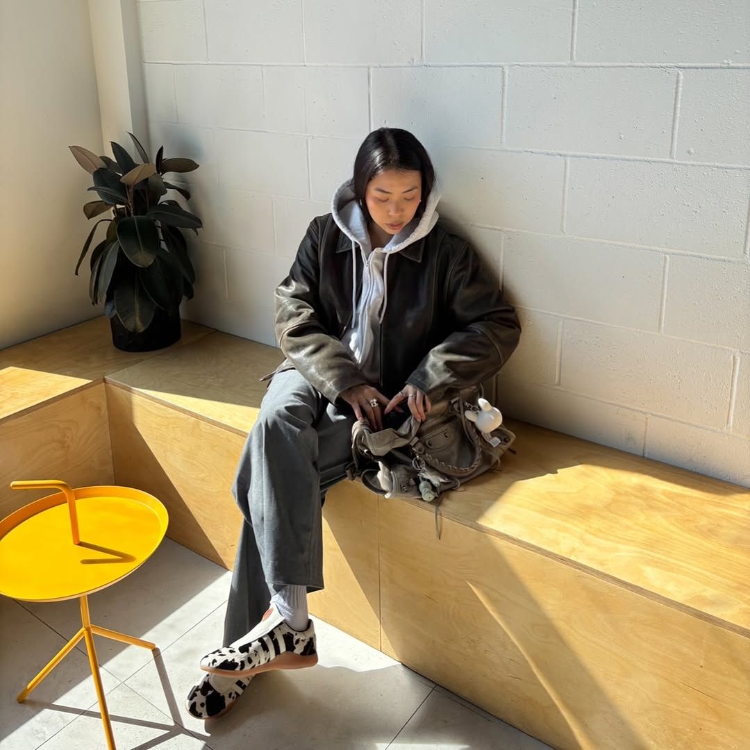 An influencer wearing adidas sneakers.