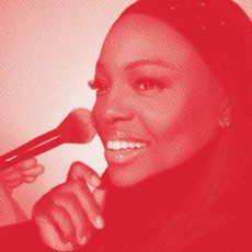 Headshot of Pat McGrath on a red background