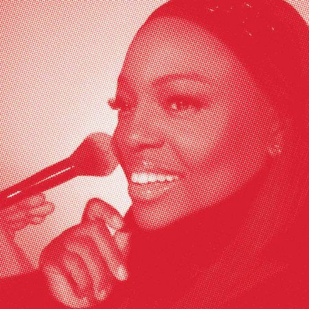 Headshot of Pat McGrath on a red background