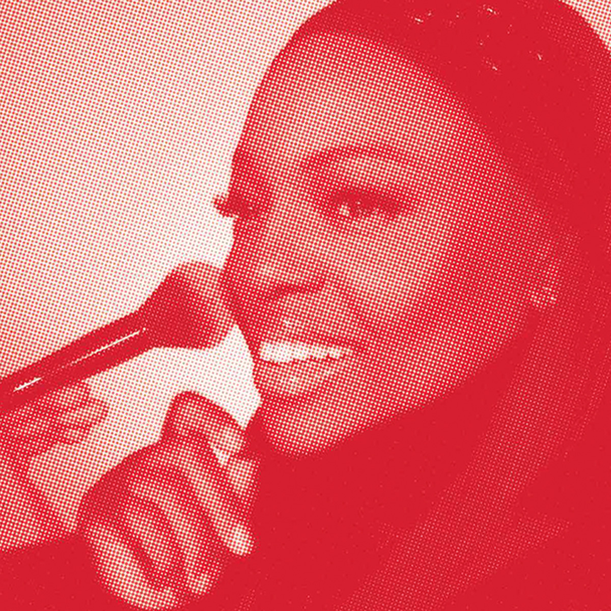 Headshot of Pat McGrath on a red background