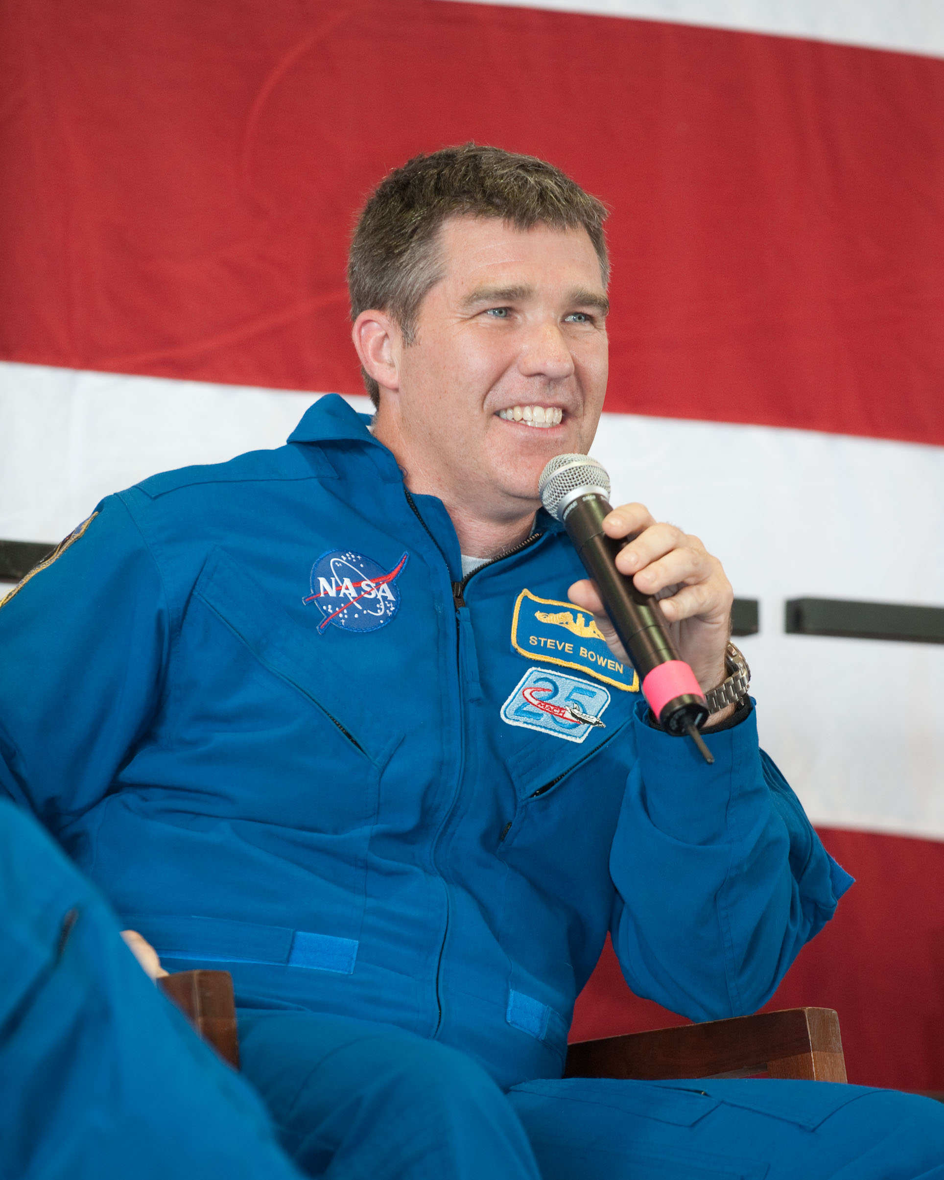 At Ellington Field&#039;s Hangar 276, NASA astronaut Steve Bowen, STS-132 mission specialist, speaks to a large crowd of visitors at the crew return ceremony for space shuttle Atlantis&#039; May 2010 mission.