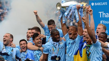 Manchester City players celebrate Premier League win