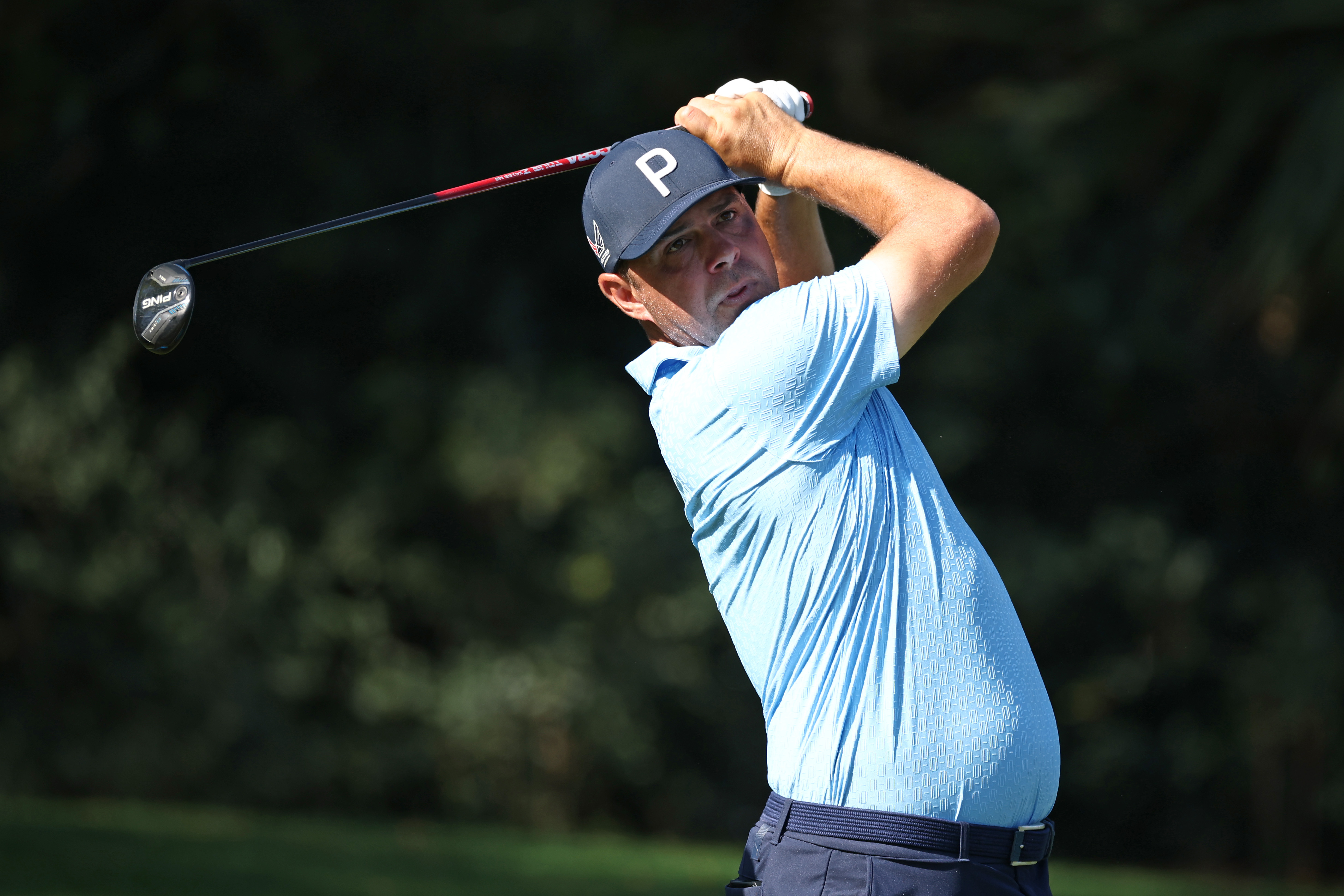 Gary Woodland holds his finish on a fairway wood shot