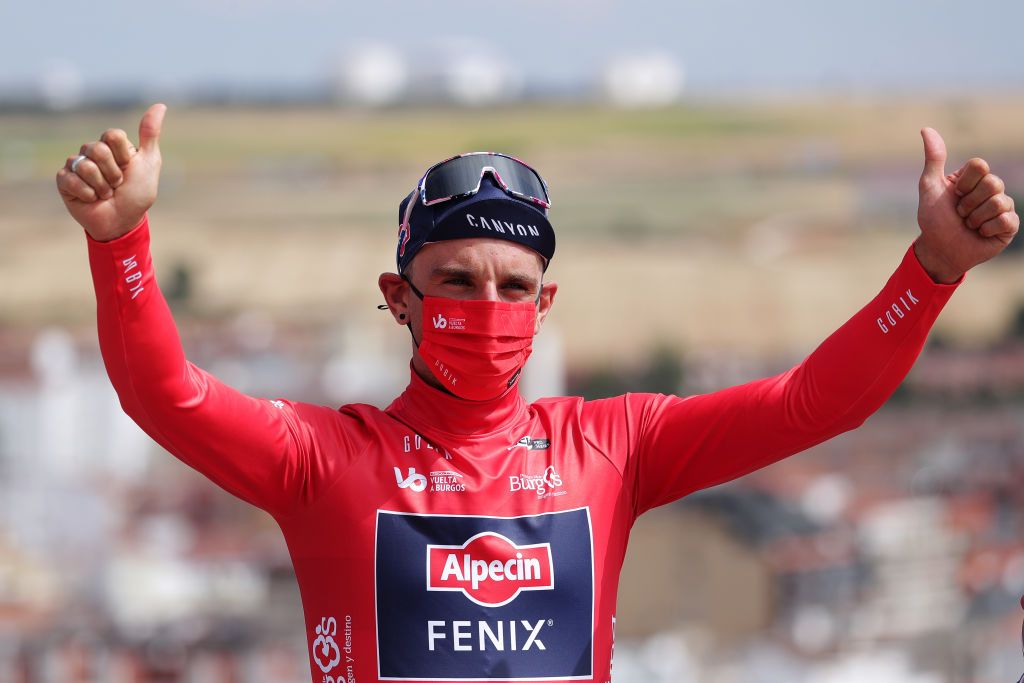 BURGOS SPAIN AUGUST 03 Edward Planckaert of Belgium and Team AlpecinFenix Red Mountain Jersey celebrates at podium during the 43rd Vuelta a Burgos 2021 Stage 1 a 161km stage from BurgosCatedral to BurgosAlto del Castillo 980m VueltaBurgos BurgosCycling CapitalMundialdelCiclismo catedral2021 on August 03 2021 in Burgos Spain Photo by Gonzalo Arroyo MorenoGetty Images
