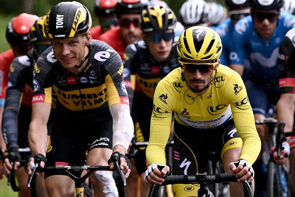 Team Deceuninck Quicksteps Julian Alaphilippe of France wearing the overall leaders yellow jersey rides in the pack during the 2nd stage of the 108th edition of the Tour de France cycling race 183 km between PerrosGuirrec and Mur de Bretagne Guerledan on June 27 2021 Photo by AnneChristine POUJOULAT AFP Photo by ANNECHRISTINE POUJOULATAFP via Getty Images