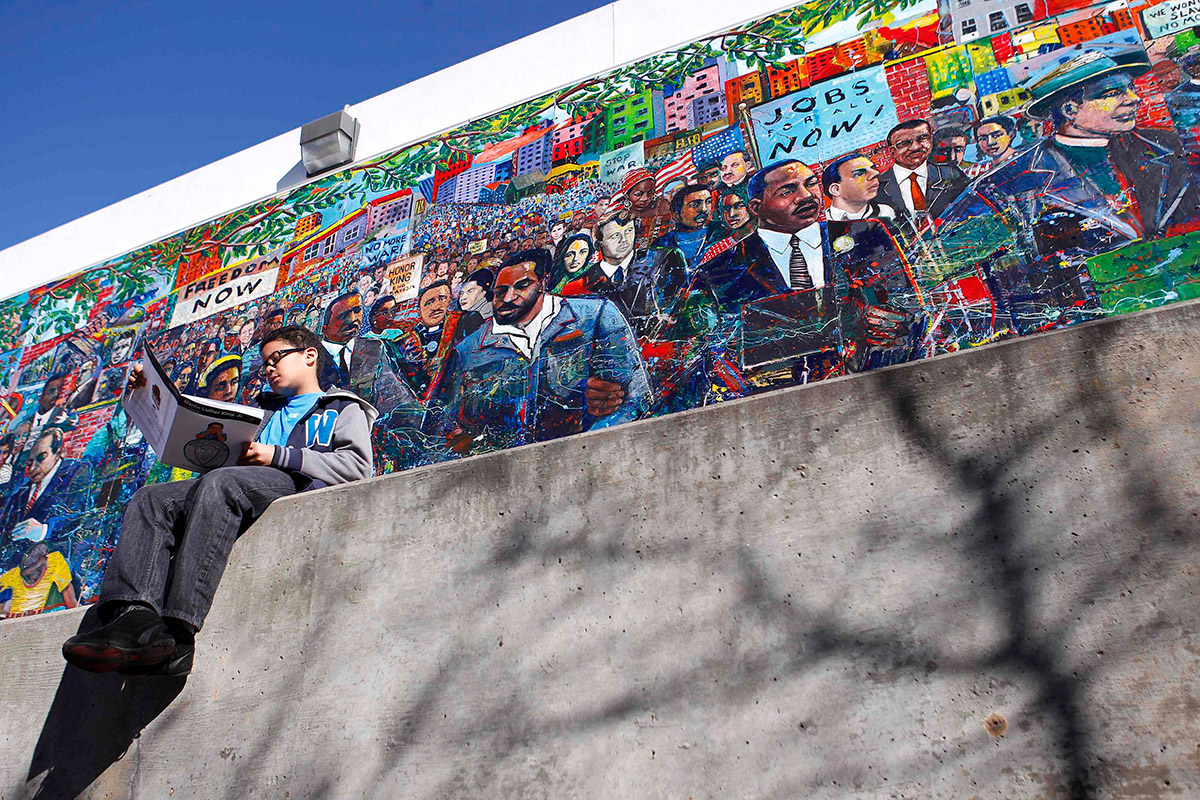 Reading near Martin Luther King, Jr. mural