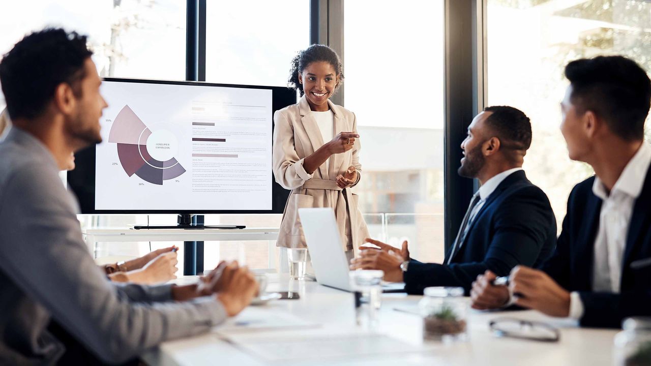 Businesswoman delivering presentation in boardroom