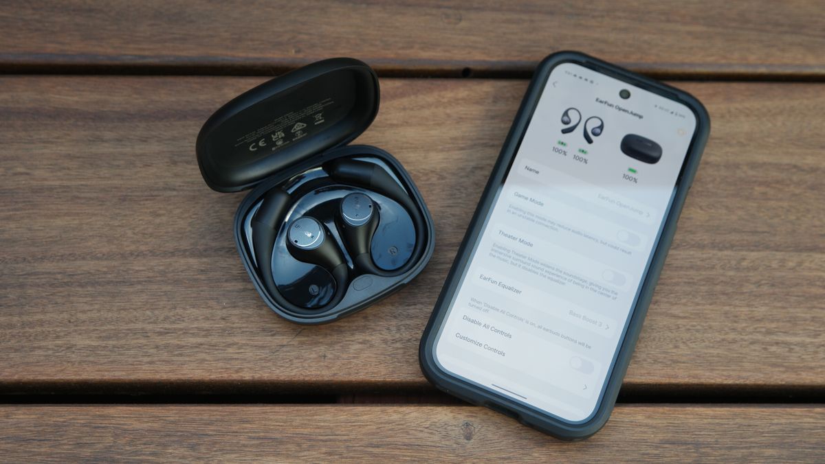 EarFun OpenJump in their case, next to a Google Pixel 9