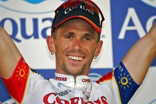 Jimmy Casper (Cofidis) salutes from the podium as the stage 1 winner