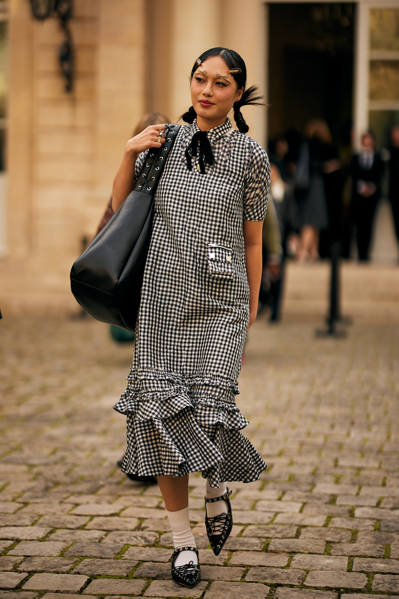woman wearing a gingham dress in Paris