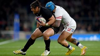 England and New Zealand players fight for the rugby ball