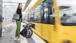 Waiting for a train with one of the best folding electric bikes: Tern Vektron S10