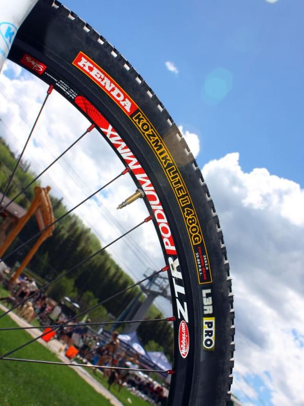 Minimal Kenda tires (converted to tubeless) are wrapped around NoTubes' latest Podium MMX wheels for an ultralight setup.