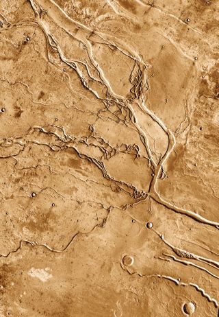 The ridge crossing the top of this image of Mars' Granicus Valles resembles ridges formed on Earth when lava erupts from fissures buried beneath thick layers of ice.