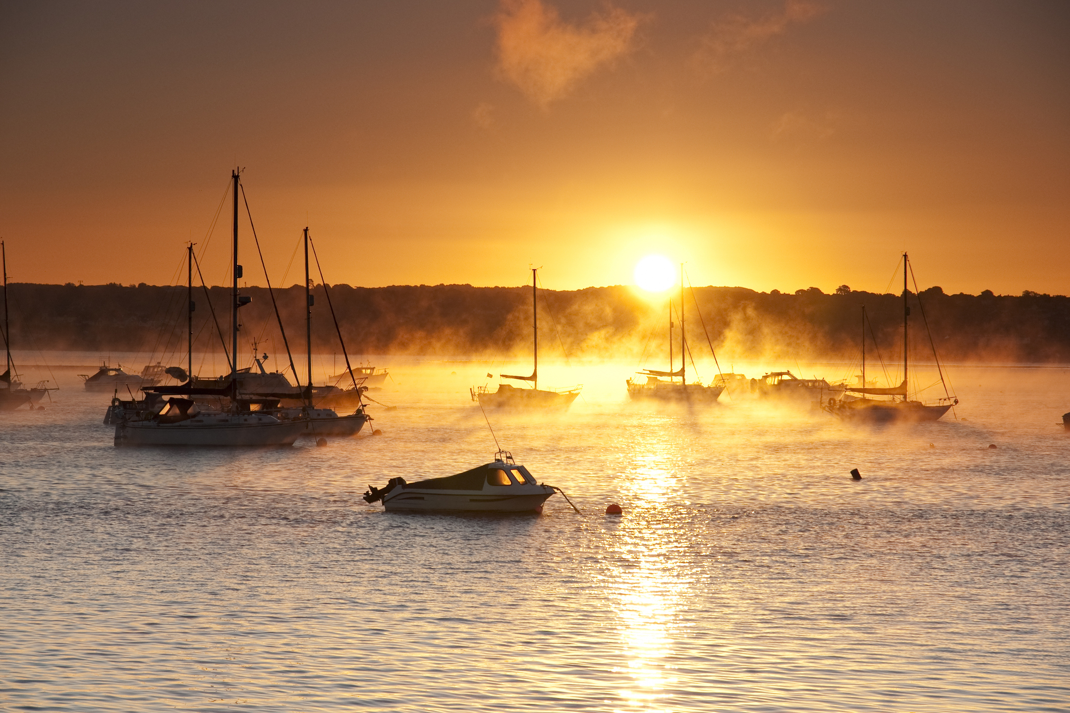 Sea fog and sunrise over the Exe estuary