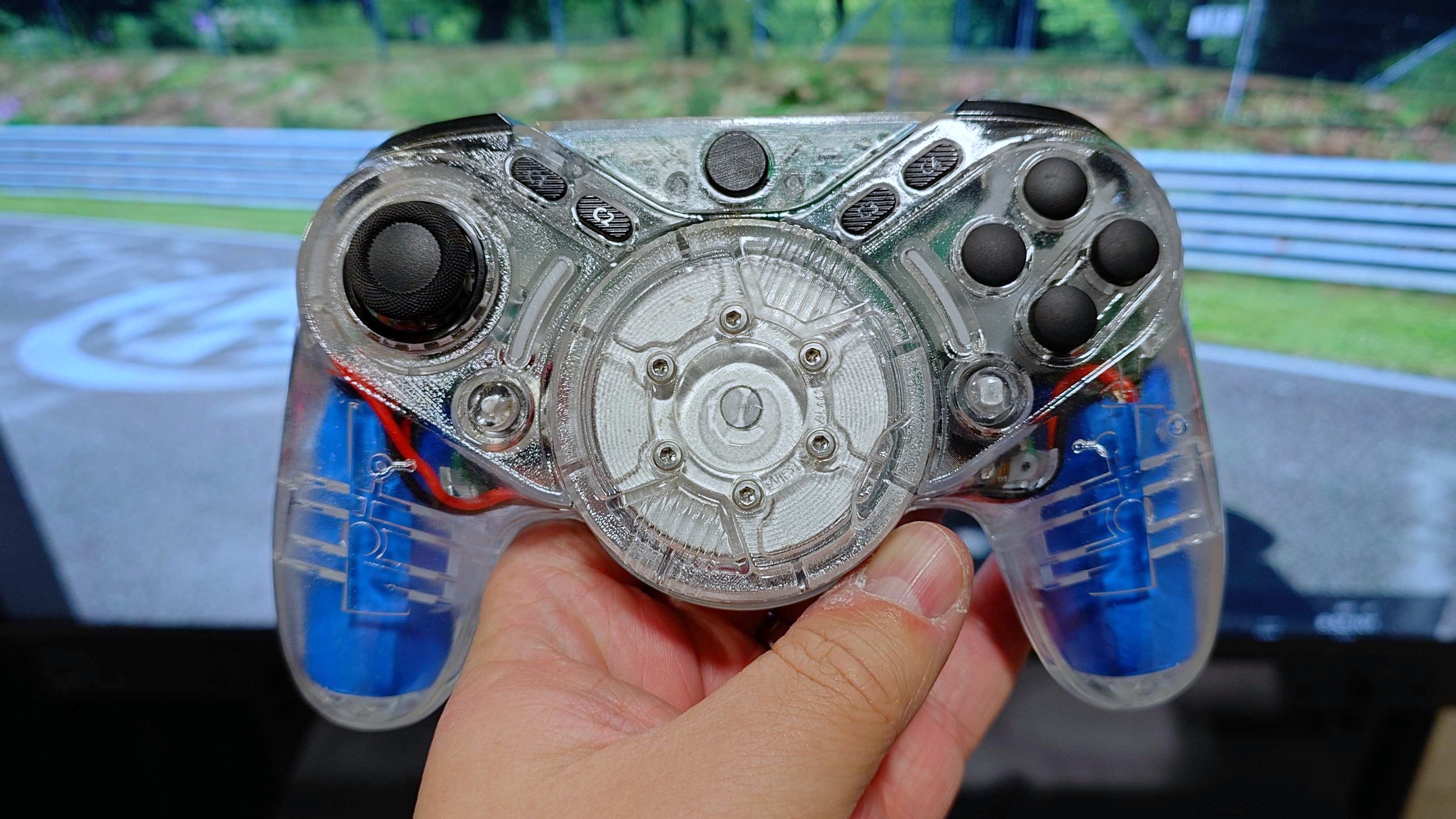 A photo of a clear-shelled prototype of the GameSir Swift Drive controller.