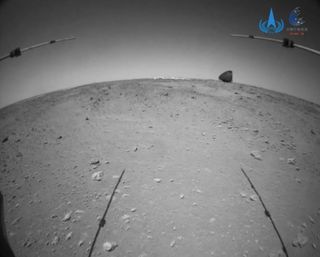 A shot of Zhurong's parachute and backshell, captured by one of the Mars rover's hazard-avoidance cameras on July 12, 2021.