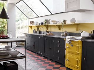 kitchen floor tile ideas with red and black checkerboard floor in black and yellow kitchen