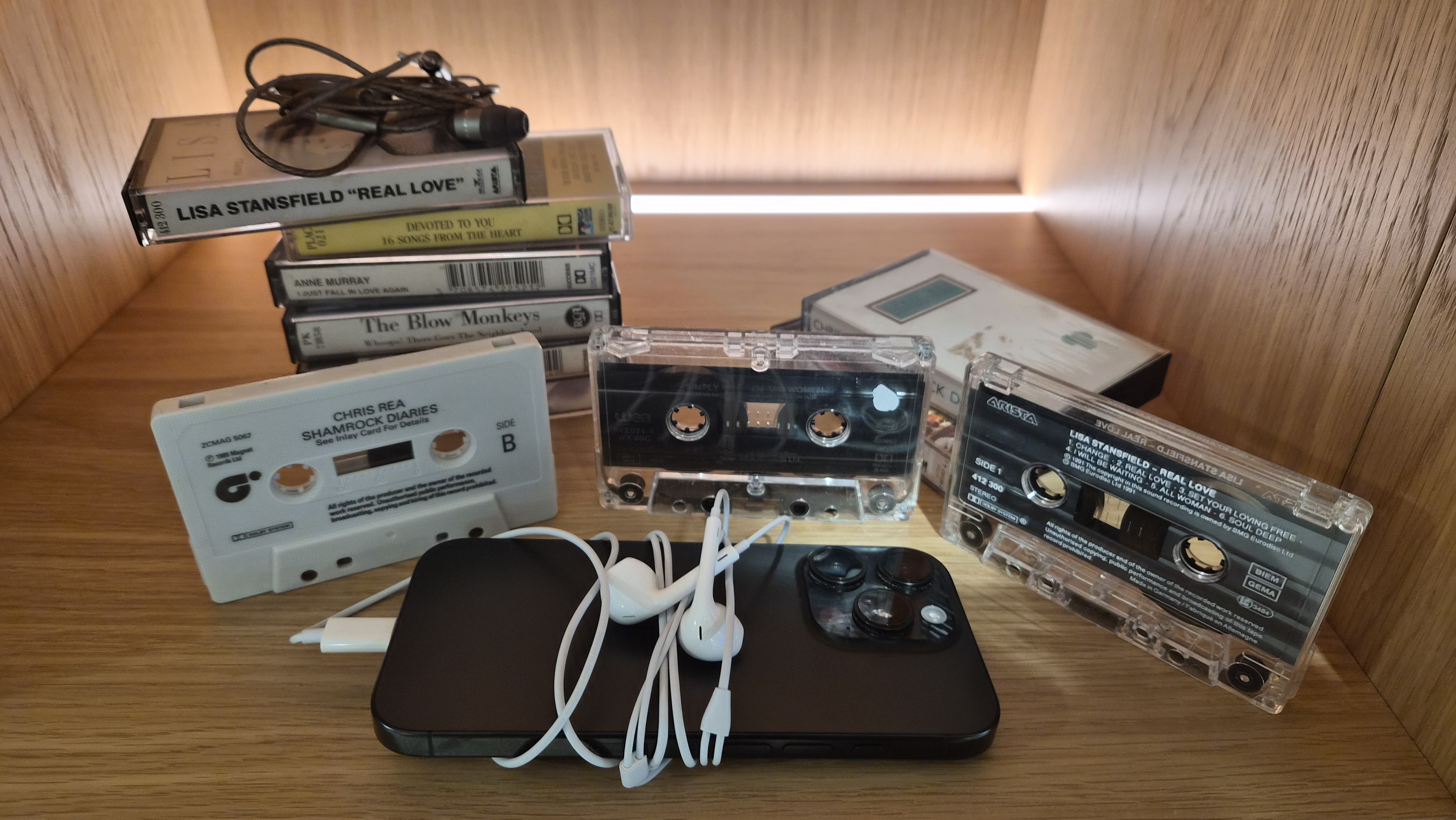 A pair of wired earbuds on a white table