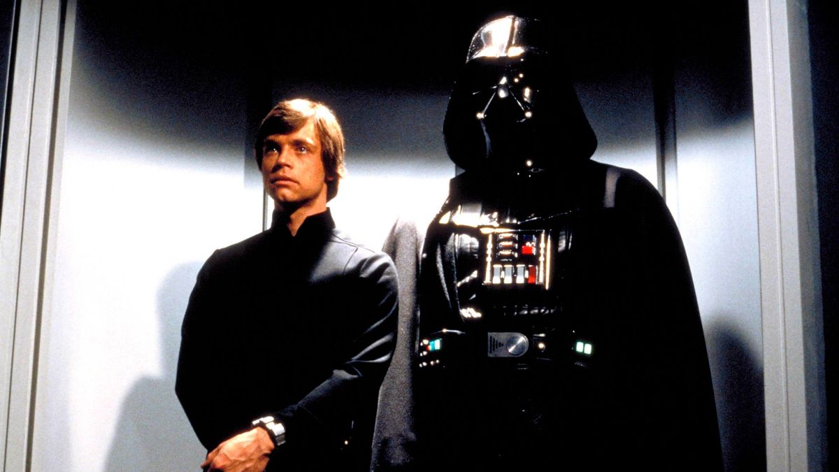 Luke Skywalker and Darth Vader standing side by side in Star Wars: Return of the Jedi