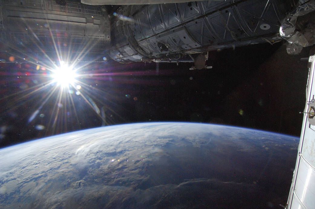 One of the astronauts of Expedition 36 to the International Space Station took this photo on May 21, 2013. In this view from one of the windows of the orbiting laboratory, the sun shines in a &quot;starburst&quot; mode above Earth&#039;s horizon.